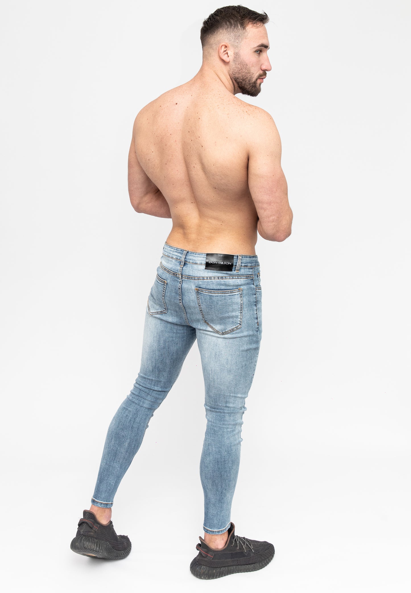 Men's Blue Skinny Fit Stretch Jeans Pants Rear Angle Pose